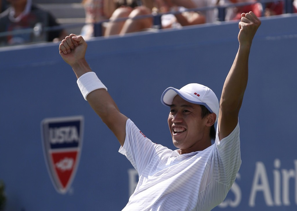 Nishikori of Japan celebrates after defeating Djokovic of Serbia in their semi-final match at the 2014 U.S. Open tennis tournament in New York
